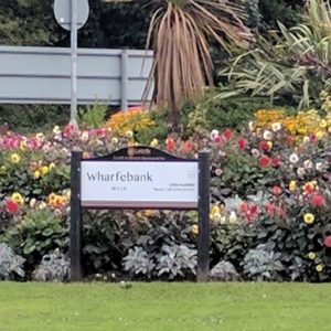 New signage for Otley roundabout sponsored by Wharfebank Mills displaying new branding.